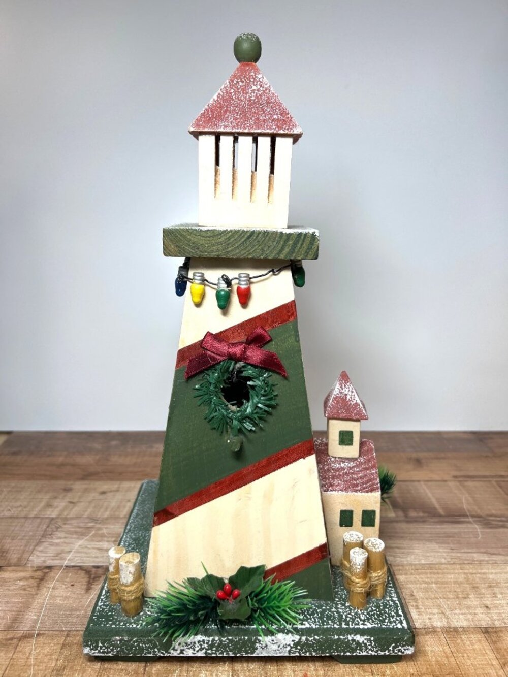Handcrafted Wooden Christmas Lighthouse With Festive Wreath Lights & Snowy Detai